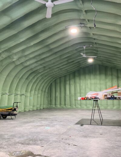 Spray Foam Insolation installed in a Large Industrial Space. Shop with well coted insolation. walls, ceilings and more.